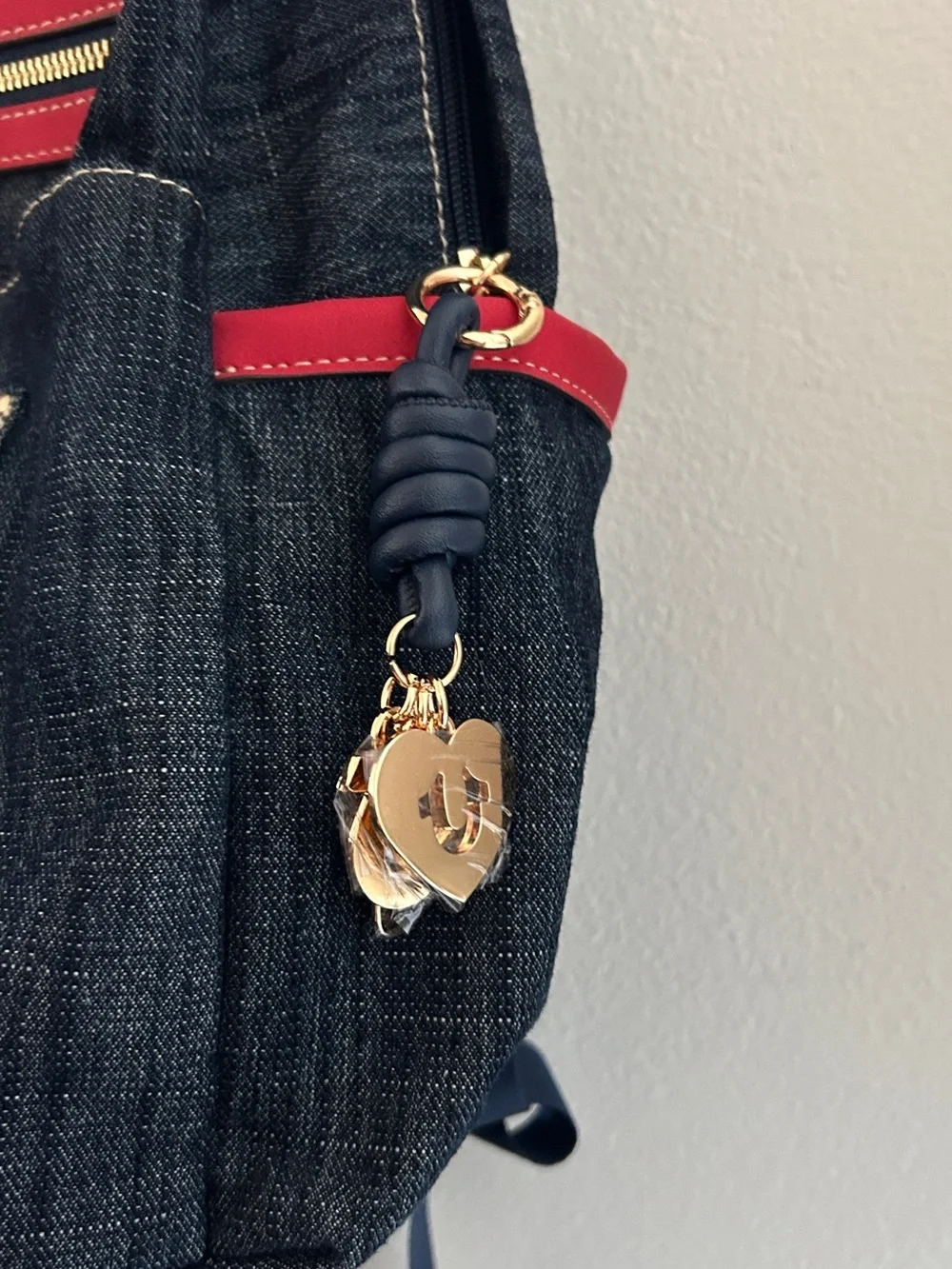 True Religion Dark Denim Backpack with Red Accents